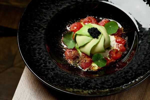 Appetizer with kimchi tomatoes, stracciatella cheese and salmon tartare