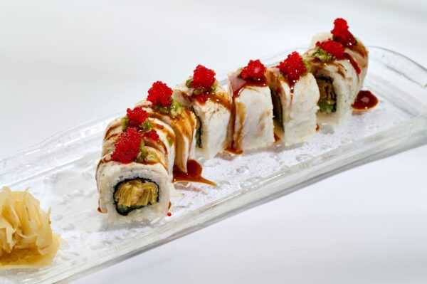 A tender roll with sea bass, truffle paste, tamago and cheese