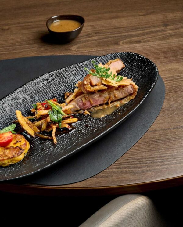 Pork sous vide in panko breadcrumbs with truffle sauce